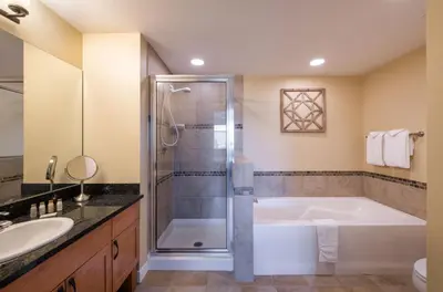 a bathroom with a tub and a shower and a sink at Winter Park FF Select Rated Condo 4654 in Winter Park