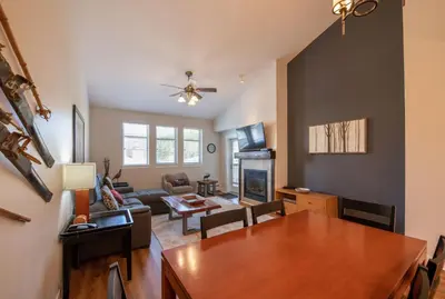a living room with a table and a dining room at Winter Park FF Select Rated Condo 4654 in Winter Park
