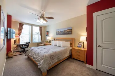 a bedroom with a bed and a ceiling fan at Beautiful Ski-In Ski-Out Condo at Fraser Crossing Founders Pointe condo in Winter Park