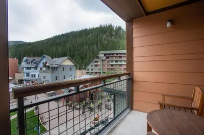 a balcony with a view of a city at Beautiful Zephyr Mountain Lodge Condo with wine coole! - Close to Gondola! condo in Winter Park