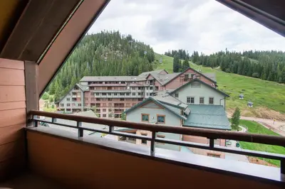 a view from the balcony of a building at Unique & Comfortable Zephyr Mountain Lodge Condo with Slope and Continental Divide View condo in Winter Park