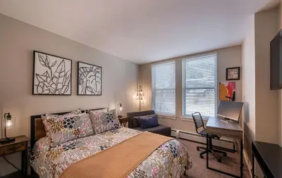 a bedroom with a bed and a desk with a computer at Winter Park FF Premium Rated Condo 4185 in Winter Park