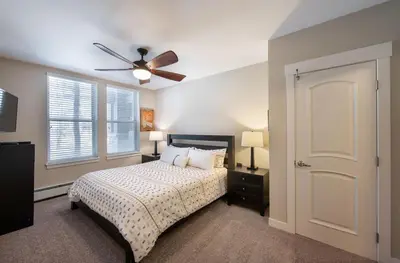 a bedroom with a bed and a ceiling fan at Winter Park FF Premium Rated Condo 4185 in Winter Park