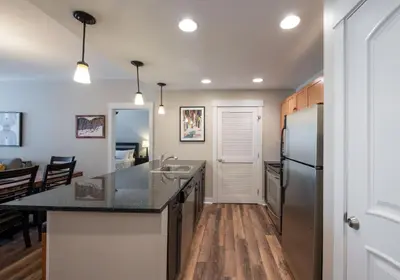 a kitchen with a sink and a refrigerator at Winter Park FF Premium Rated Condo 4185 in Winter Park