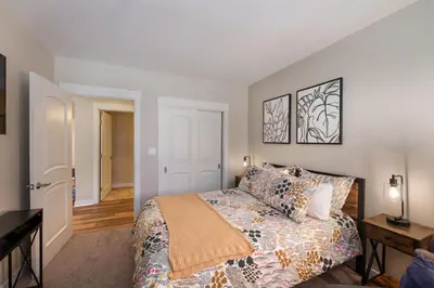 a bedroom with a king sized bed and a table at Winter Park FF Premium Rated Condo 4185 in Winter Park