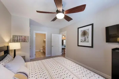 a bedroom with a ceiling fan and a bed at Winter Park FF Premium Rated Condo 4185 in Winter Park