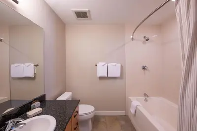 a bathroom with a sink and a toilet and a tub at Winter Park FF Premium Rated Condo 4185 in Winter Park