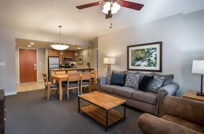 a living room with a couch and a table at Beautiful Fraser Crossing Founders Pointe Condo with Upgraded Furnishings condo in Winter Park