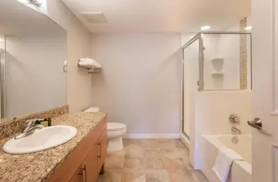 a bathroom with a sink and a toilet and a shower at Beautiful Fraser Crossing Founders Pointe Condo with Upgraded Furnishings condo in Winter Park