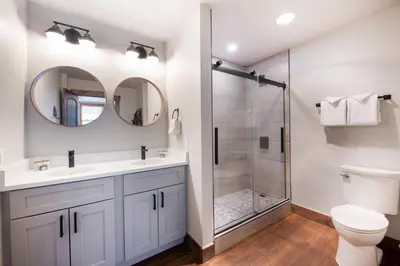 a bathroom with a shower and a toilet at Warm & Cozy Zephyr Mountain Lodge condo with Arapahoe Forest and Corridor Ski Trail Views condo in Winter Park