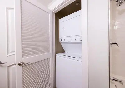 a white laundry room with a washer and dryer at Winter Park FF Premium Rated Condo 3511 in Winter Park