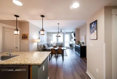 a kitchen and living room with a table and chairs at Winter Park FF Premium Rated Condo 3511 in Winter Park