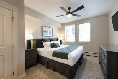 a bedroom with a bed and a ceiling fan at Winter Park FF Premium Rated Condo 3511 in Winter Park