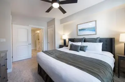 a bedroom with a large bed and a ceiling fan at Winter Park FF Premium Rated Condo 3511 in Winter Park