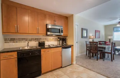 a kitchen with a sink and a stove top oven at Charming Fraser Crossing Founders Pointe condo with Easy Gondola Access condo in Winter Park
