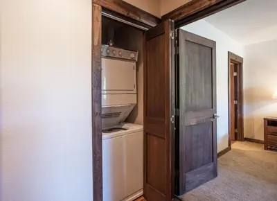 an open door to a refrigerator in a room at Outstanding Zephyr Mountain Lodge Condo with Ski Slope Views condo in Winter Park