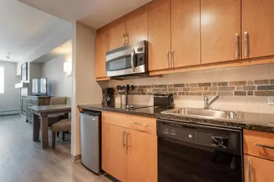 a kitchen with a sink and a microwave at Cozy Fraser Crossing Founders Pointe Studio Condo Close to Mountain condo in Winter Park