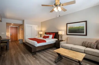a bedroom with a bed and a couch at Cozy Fraser Crossing Founders Pointe Studio Condo Close to Mountain condo in Winter Park