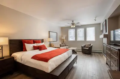 a bedroom with a large bed and a television at Cozy Fraser Crossing Founders Pointe Studio Condo Close to Mountain condo in Winter Park