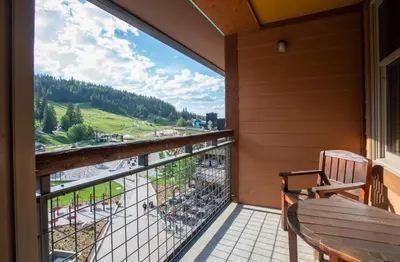 a balcony with a bench and a view at Spectacular Zephyr Mountain Lodge Condo with Ski Slope View condo in Winter Park