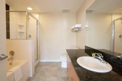 a bathroom with a sink and a shower and a toilet at Comfortable Fraser Crossing Founders Pointe Condo Near Gondola with Onsite Ski Storage condo in Winter Park