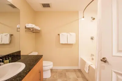 a bathroom with a sink and a toilet and a shower at Comfortable Fraser Crossing Founders Pointe Condo Near Gondola with Onsite Ski Storage condo in Winter Park