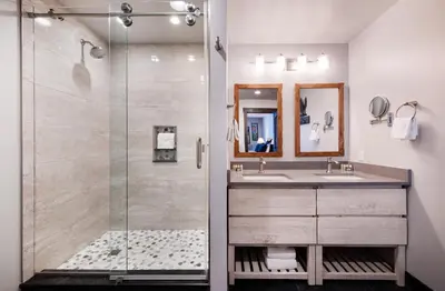 a bathroom with a shower and a sink at Cozy Zephyr Mountain Lodge condo with sweeping views of Arapahoe National Forest condo in Winter Park