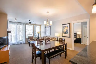 a dining room and living room with a table and chairs at Townhome Style Fraser Crossing Founders Pointe Condo with Upgraded Furnishings and washer dryer condo in Winter Park