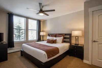 a bedroom with a bed and a ceiling fan at Townhome Style Fraser Crossing Founders Pointe Condo with Upgraded Furnishings and washer dryer condo in Winter Park