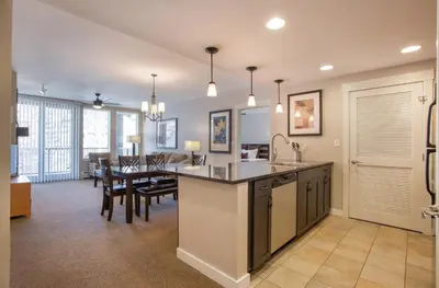 a kitchen and dining room with a table and chairs at Townhome Style Fraser Crossing Founders Pointe Condo with Upgraded Furnishings and washer dryer condo in Winter Park