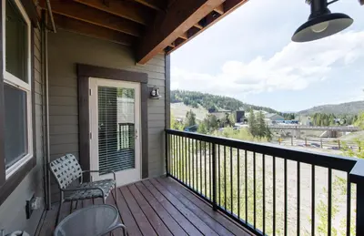 a balcony with chairs and a view of the mountains at Winter Park FF Premium Rated Condo 3506 in Winter Park