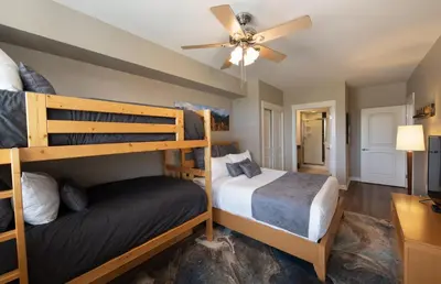 a bedroom with two bunk beds and a ceiling fan at Winter Park FF Premium Rated Condo 3506 in Winter Park