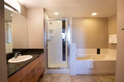 a bathroom with a shower and a sink and a tub at Winter Park FF Premium Rated Condo 3506 in Winter Park
