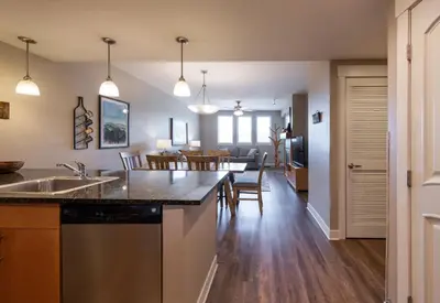 an open kitchen and dining room with a dining table at Winter Park FF Premium Rated Condo 3506 in Winter Park