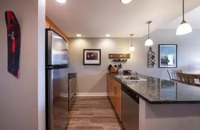 a large kitchen with a stainless steel refrigerator at Winter Park FF Premium Rated Condo 3506 in Winter Park