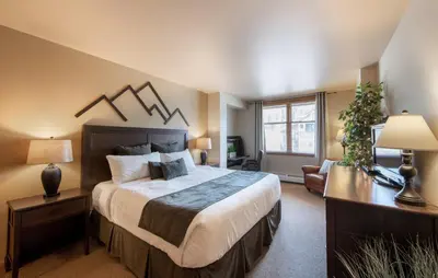 a bedroom with a large bed in a room at Great Zephyr Mountain Lodge Condo with Village & Continental Divide Views condo in Winter Park