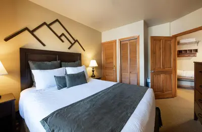 a bedroom with a large bed in a room at Great Zephyr Mountain Lodge Condo with Village & Continental Divide Views condo in Winter Park