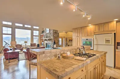 a kitchen with a large island in a room at Grand Fraser Escape with Private Deck and Hot Tub in Fraser