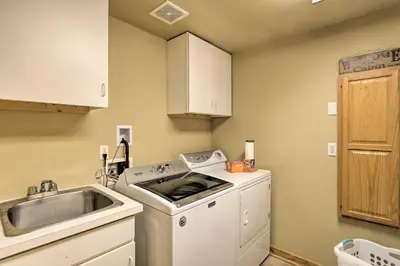 a kitchen with a washing machine and a sink at Grand Fraser Escape with Private Deck and Hot Tub in Fraser