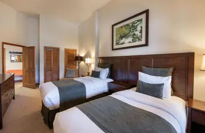 a hotel room with two beds and a television at Zephyr Mountain Lodge - Premium Rated Condo 1701 in Winter Park