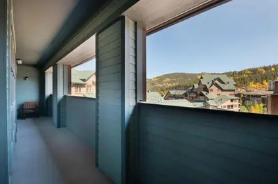 a balcony with a view of a town at Zephyr Mountain Lodge - Premium Rated Condo 1701 in Winter Park