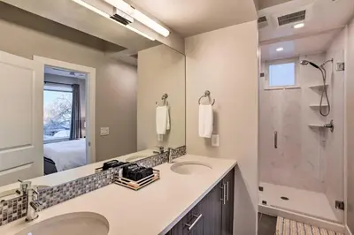a bathroom with two sinks and a shower at Denver Tennyson Townhouse with Rooftop Deck in Denver