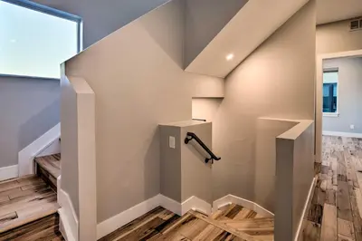 a staircase in a house with wood floors at Denver Tennyson Townhouse with Rooftop Deck in Denver