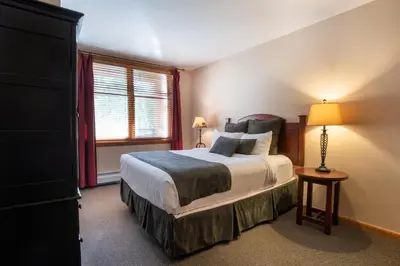 a bedroom with a large bed and a window at Zephyr Mountain Lodge Value-Rated 2202 in Winter Park