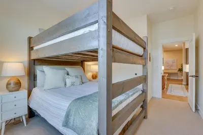 a bedroom with a large wooden bunk bed at Winter Park Condo with Balcony about 4 Mi to Slopes in Winter Park
