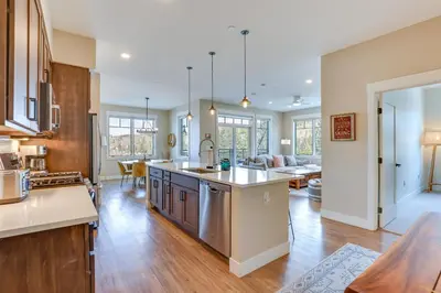an open kitchen and living room in a home at Winter Park Condo with Balcony about 4 Mi to Slopes in Winter Park