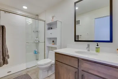 a bathroom with a toilet and a sink and a shower at Winter Park Condo with Balcony about 4 Mi to Slopes in Winter Park