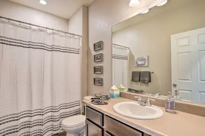 a bathroom with a sink and a toilet and a shower at Dreamy Windsor Home with Grill about 3 Miles to Lake! in Windsor