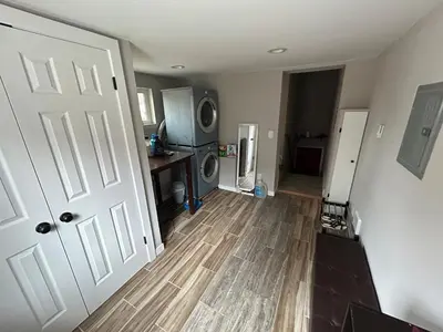 an open door to a living room with a kitchen at Basement Unit 2br 2ba in Barnum West Near Belmar and Sloan Lake 10 mins to Downtown in Denver