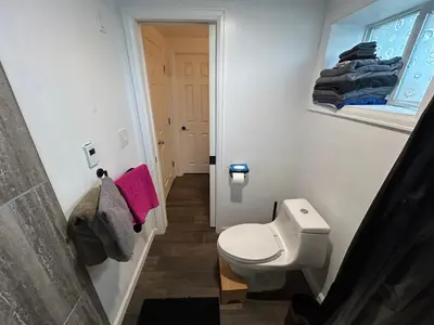 a small bathroom with a toilet and a sink at Basement Unit 2br 2ba in Barnum West Near Belmar and Sloan Lake 10 mins to Downtown in Denver
